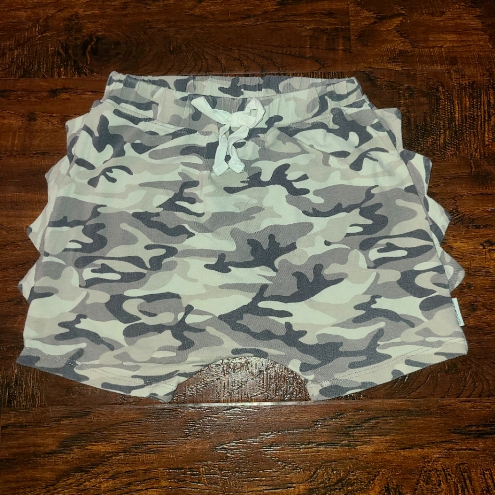 The Mini Classy brand harem shorts with trademark dino spikes along sides.